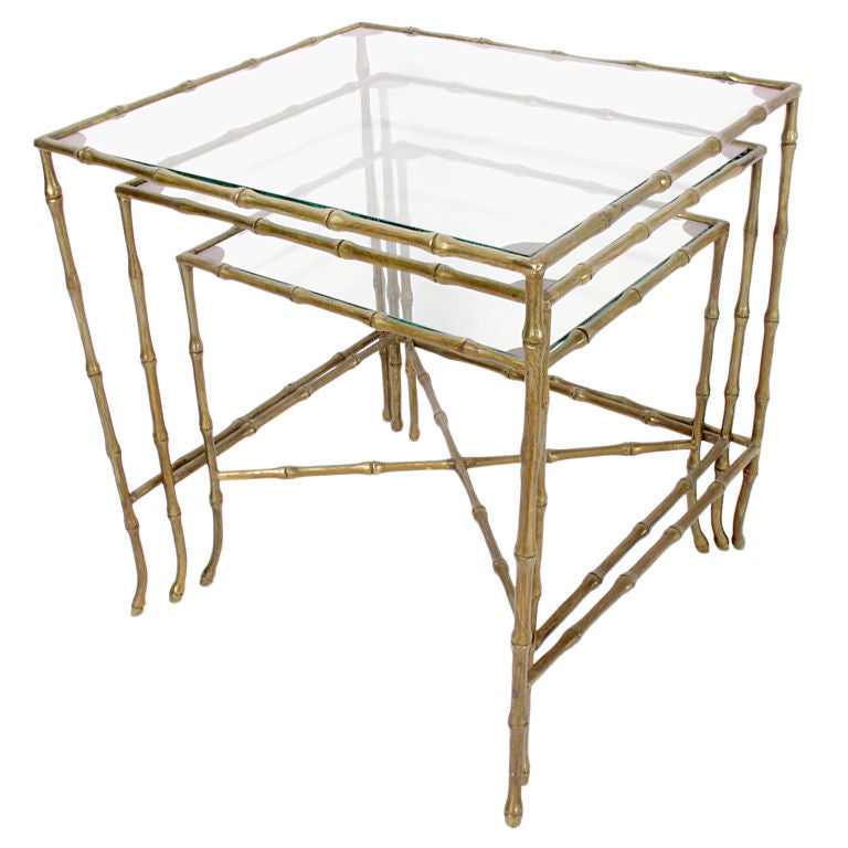 Brass Bamboo Form Nesting Tables, attributed to Bagues, circa 1940's. They retain their warm original patina. Excellent attention to detail with heavyweight solid brass construction and crisp, detailed casting. The tables are a versatile size,