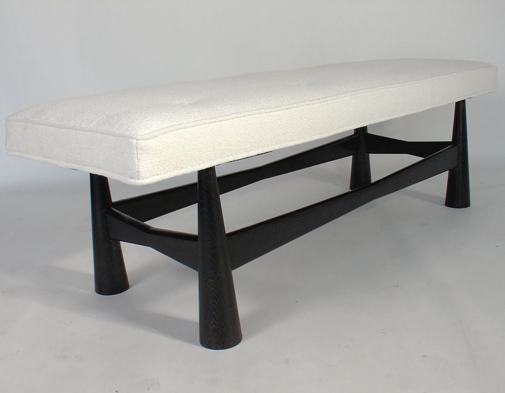 Modernist Bench with Sculptural Limed Oak Base, American, circa 1950's. The sculptural base has been refinished in a deep brown limed oak finish, and it has been reupholstered in an ivory color nubby boucle fabric.
