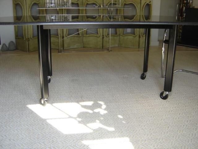 Joe D'urso granite top racetrack table on castors by Knoll In Excellent Condition For Sale In Sag Harbor, NY
