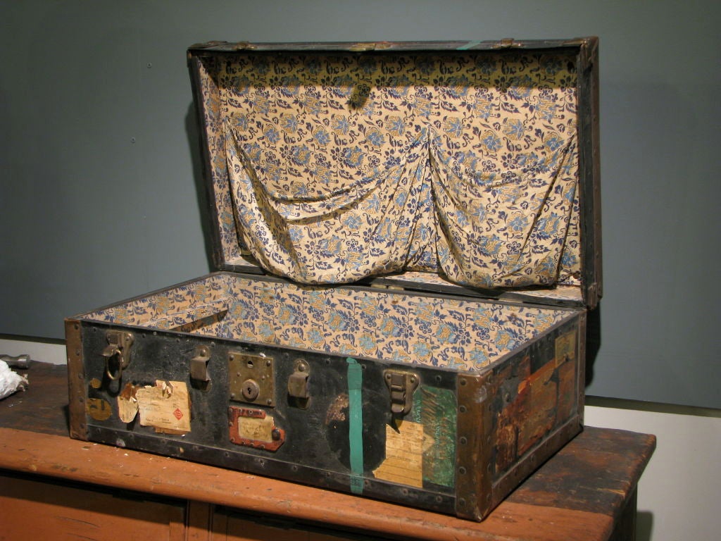 Luggage Trunk Lined in Vintage Floral Fabric with travel stamps and stickers<br />
<br />
Heir Antiques<br />
617-216-0839<br />
tyler@heirantiques.com<br />
specializing in folk art, industrial, rustic modern, vintage lighting and victorian