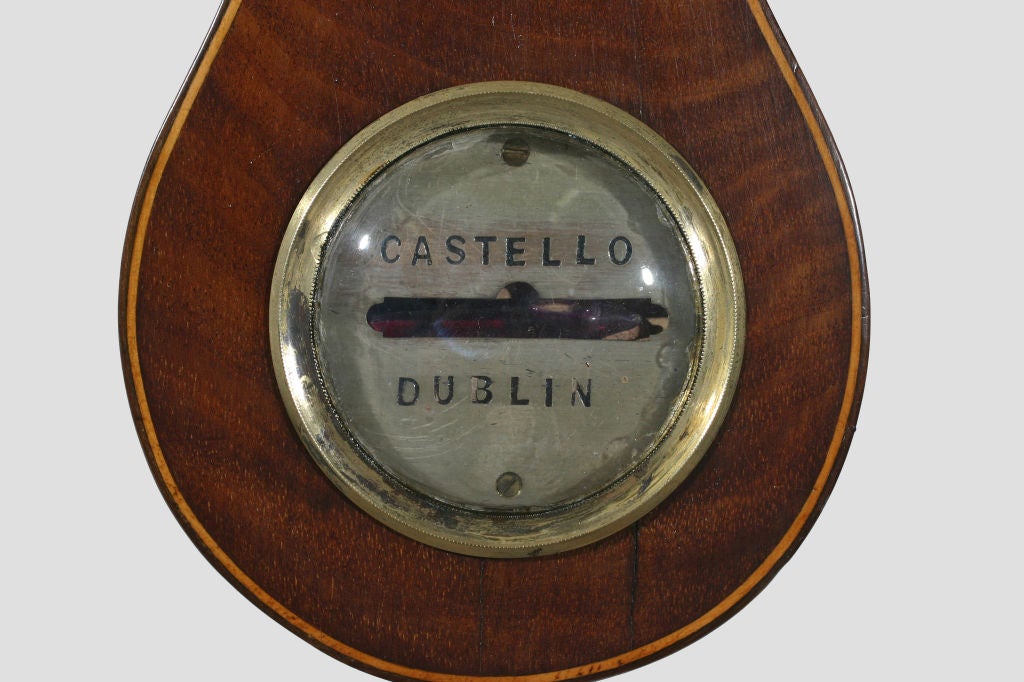 An Irish Mahogany String Inlaid Banjo Form Barometer.<br />
Maker: Castello, Dublin. Fitted with new mercury tube.