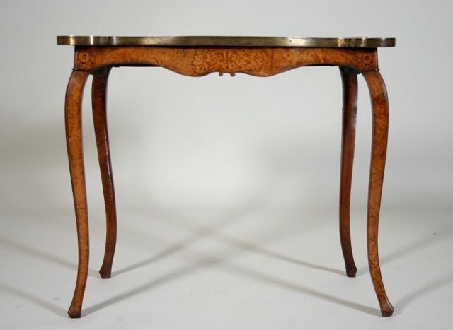 A mid-18th century George II period burl walnut marquetry and feathered herringbone inlaid console table with a brass banded edge and elm legs.