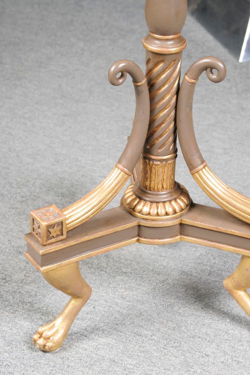 Regency period painted and parcel gilt octagonal table on tripod base featuring lion paw form. Based on a design by George and Richard Gillow of Oxford St. A similar example a similar was know to have been made by Gillow in 1803 for Stephen Tempest
