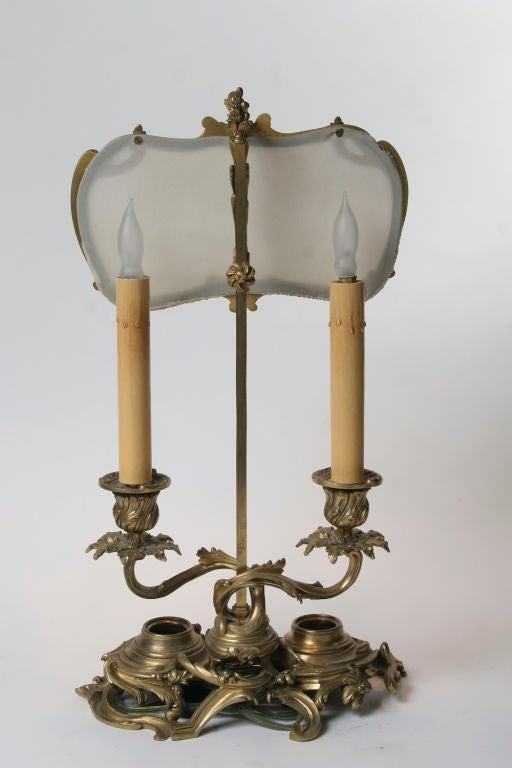 Finely cast Louis XV style gilt bronze candlestick lamp.