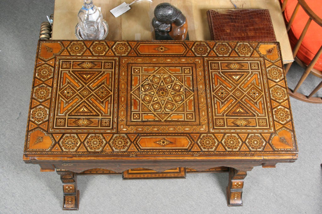 Extremely fine Syrian gaming table, extensively inlaid with walnut, ebony, boxwood and mother of pearl. Opens to become a card table upholstered with green velvet, then further opens to reveal chess and backgammon boards. Also fitted with four