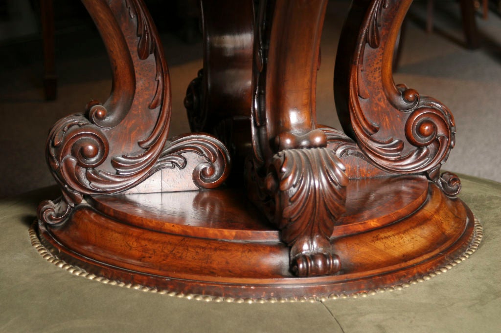 Important William IV period circular table. The burl walnut top extensively inlaid with intricate marquetry, resting on a circular base fitted with an upholstered footrest.