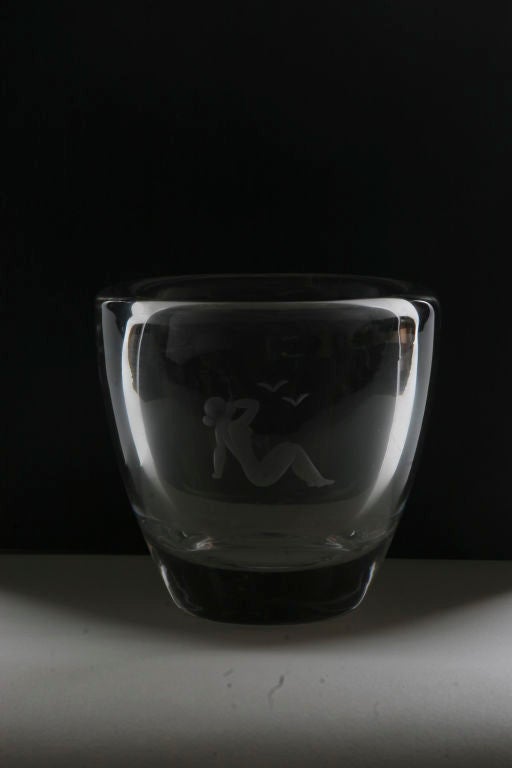 An Orrefors etched glass vase.