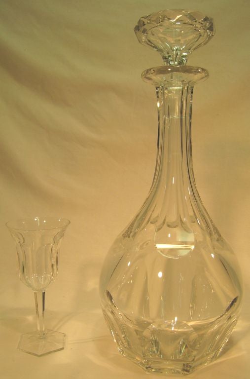 Baccarat crystal magnum decanter in Harcourt pattern with its  heavily faceted stopper. Stamped Baccarat France on bottom.<br />
Sets of twelve each of water glasses, wine goblets, and champagne flutes are available, sold separately.