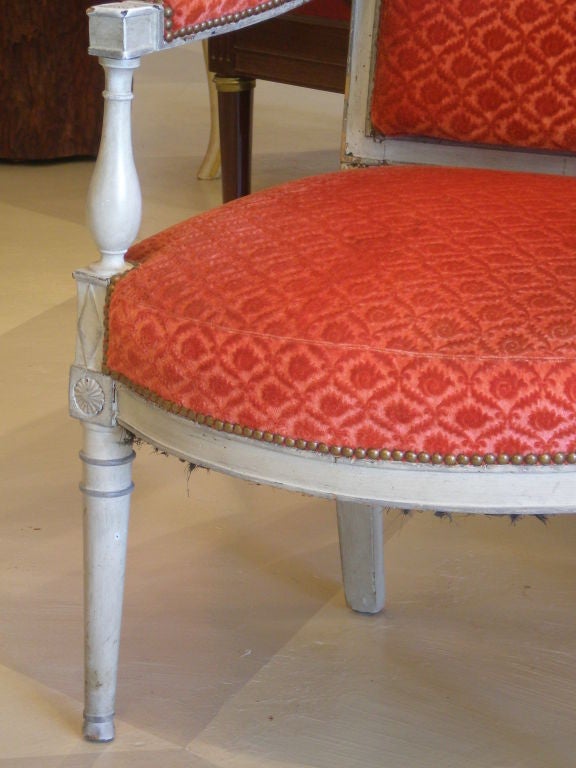 Matched Pair of French Grey Painted Fauteuils, one 18th Century 1