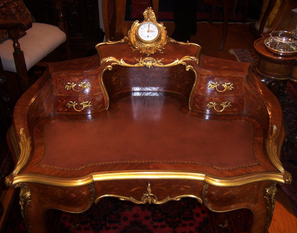 Fabulous and rare Louis XV style bureau à gradin, or tiered desk, the upper structure of kidney-shape form, the desk decorated on all sides with magnificent kingwood and satinwood marquetry, enhanced by superbly cast ormolu mounts, an elegant white