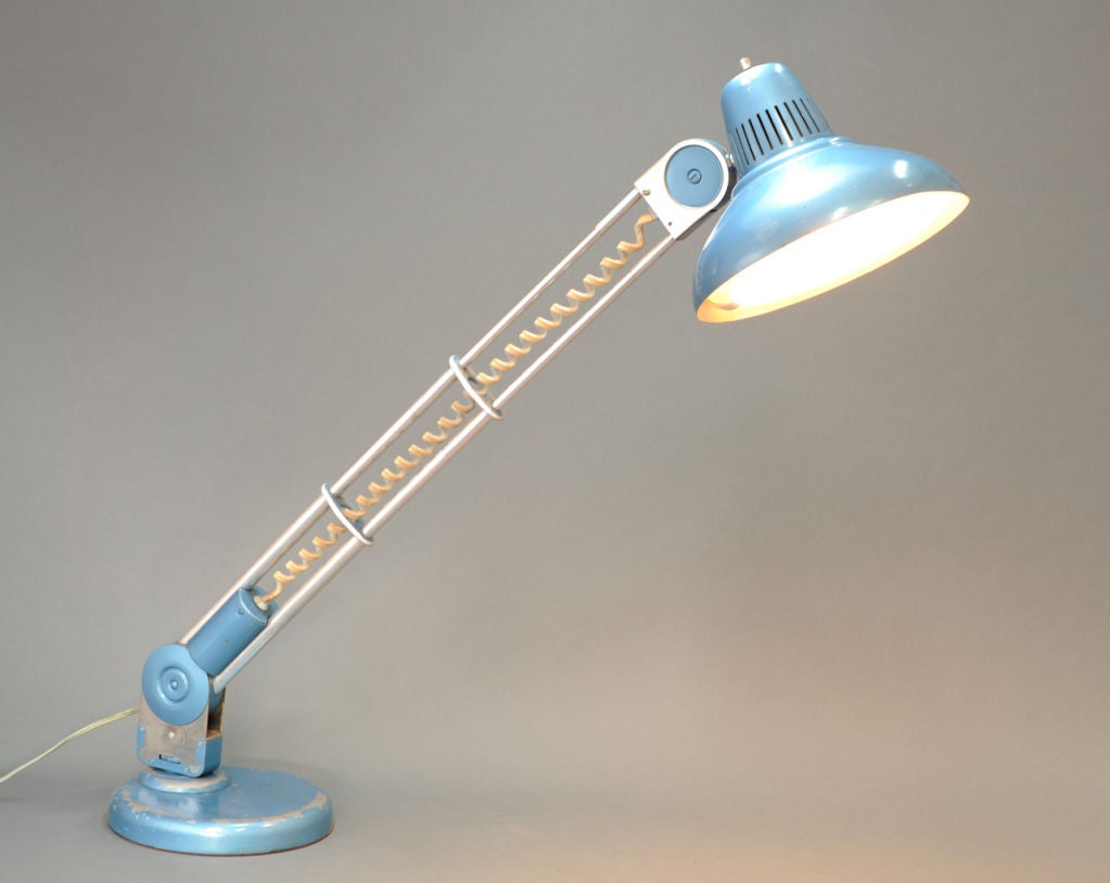 Great color and function in this Amplex Trombolite lamp.  The arm in fully rotational and telescopes an additional 12