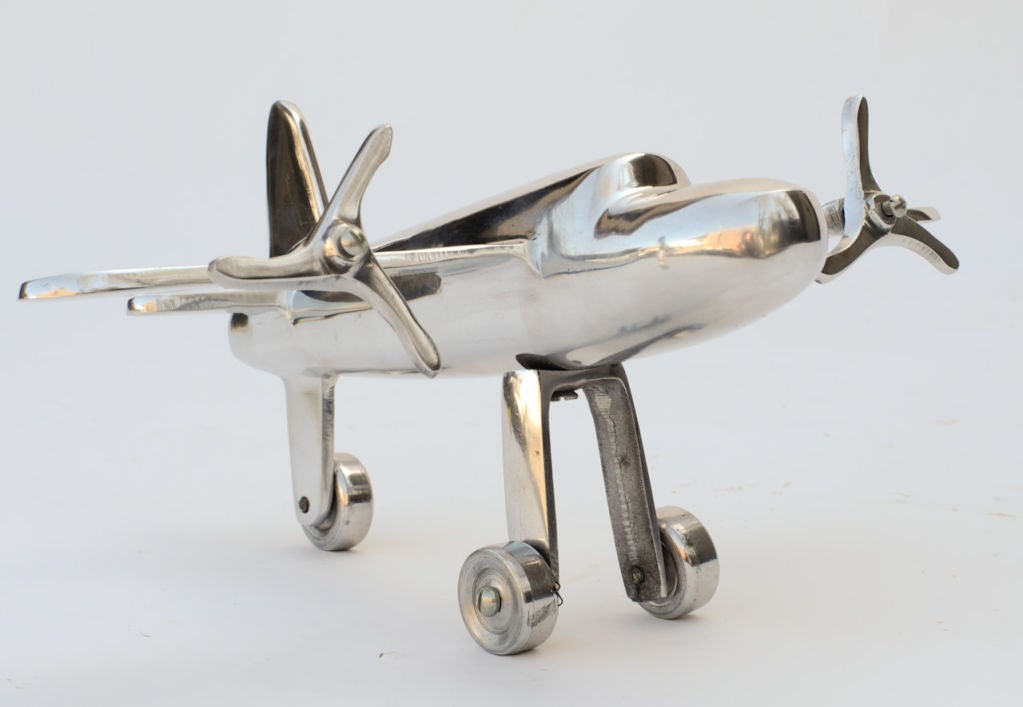 A model of the Douglas DC-3 Plane that revolutionized the air transport industry in the 1930's.  Polished to a mirror shine from a hand tooled machine shop