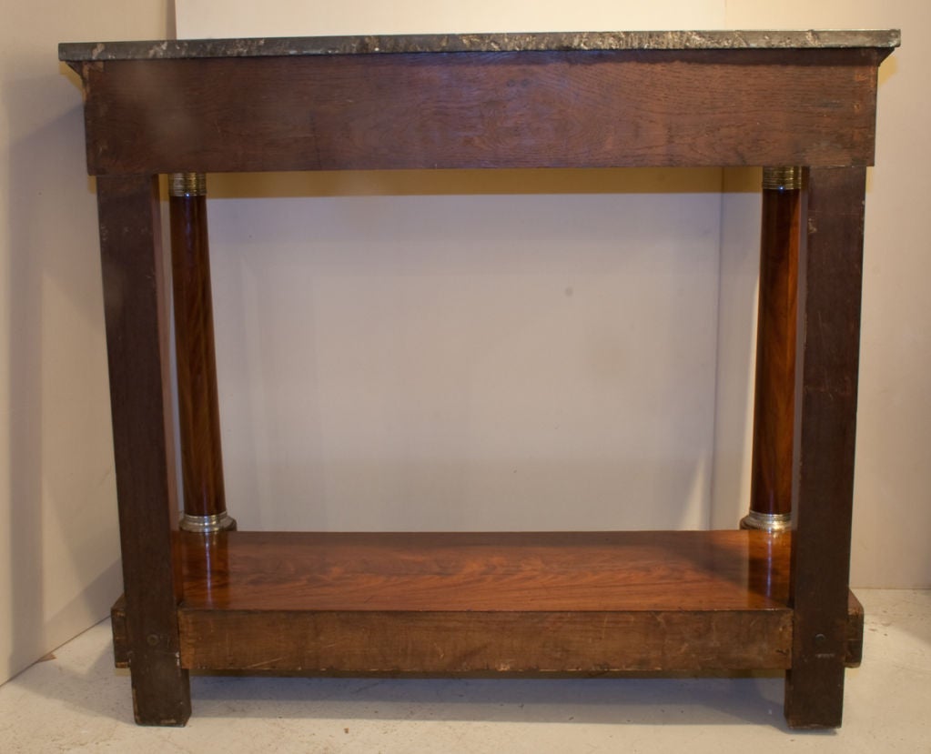 FRENCH EMPIRE PERIOD FLAME MAHOGANY CONSOLE, CIRCA 1810