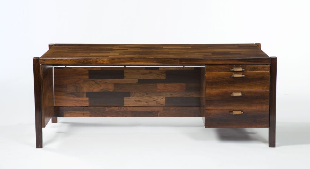 Large patchwork veneer desk in jacaranda with 4 drawers on one side and vanity screen. Designed by Jorge Zalszupin, Brazil, 1970.
