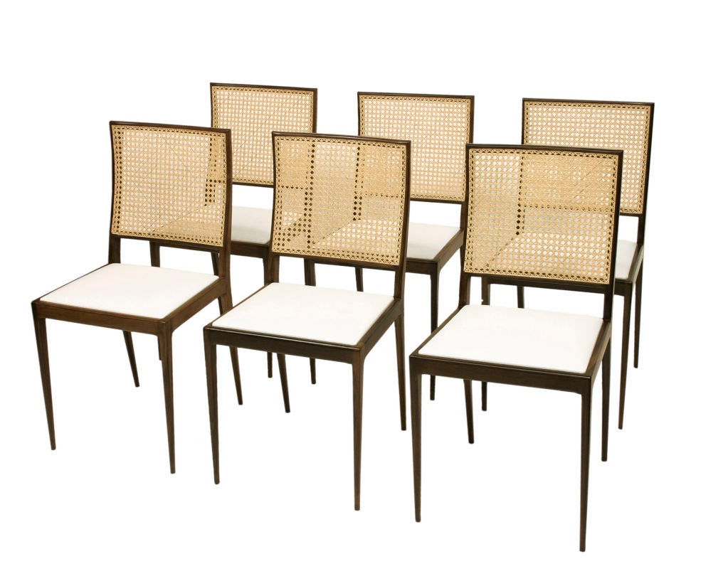 Set of six chairs in jacaranda with woven cane backs and upholstered seats. Designed by Joaquim Tenreiro, Brazil, 1950. (Seat height: 17.5
