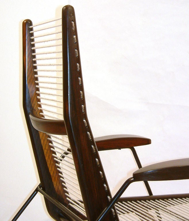 Armchair with jacaranda frame and arms, string seat and back and metal legs. Brazil, 1950s. (Seat height: 16