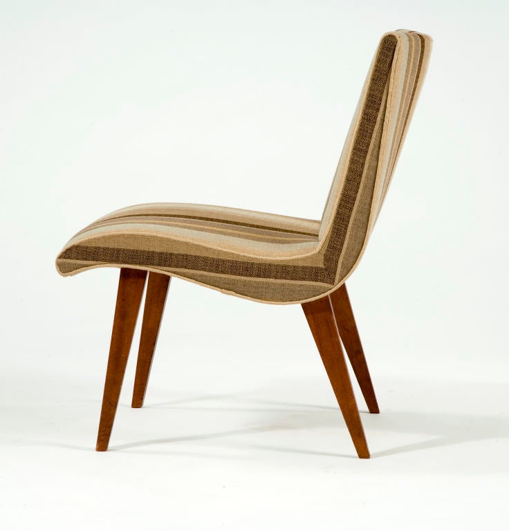 Upholstered lounge chair in imbuia wood. Designed by Joaquim Tenreiro, Brazil, 1958.