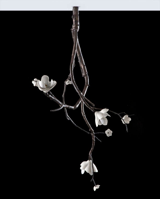 Unique large ceiling mounted branch sculpture in bronze with illuminated white porcelain blossoms. Designed and made by David Wiseman, USA, 2009.