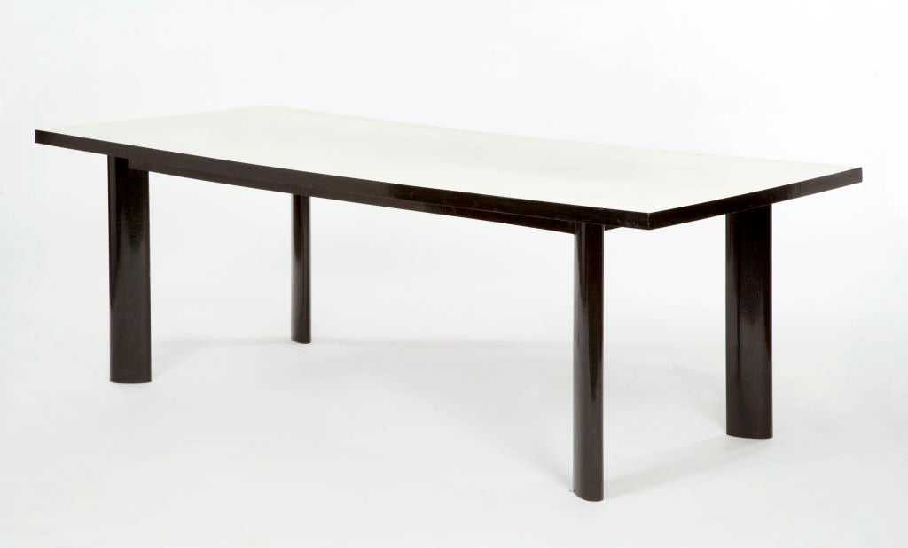 Dining table in ebonized caviona with white laminated top. Designed by Joaquim Tenreiro, Brazil, 1960s.