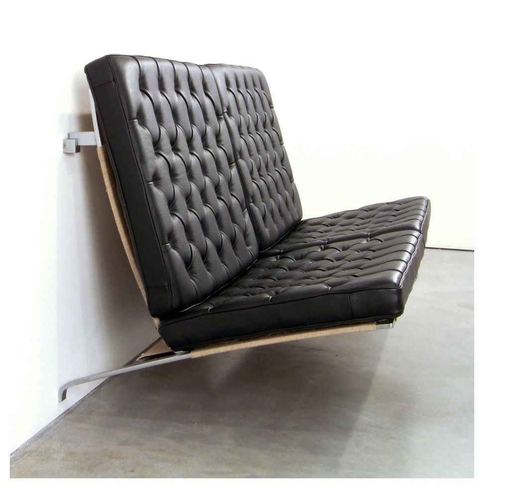 PK 26 two-seat suspended sofa in black leather with steel frame and canvas webbing. Designed by Poul Kjaerholm for Fritz Hansen, Denmark, circa 1988.