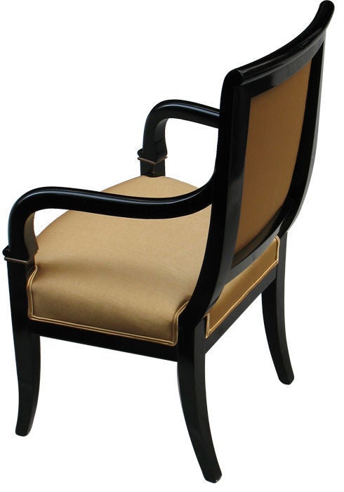 Elegant pair of ebonized Biedermeier arm chairs