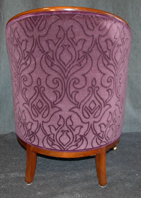Pair of 1930's purple velvet club chair wit wheels on front legs.

Measurements:
34
