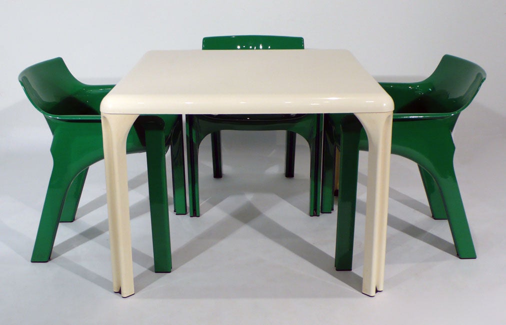 Set of four Vico Magistretti designed Gaudi Chairs in Kelly Green with matching table for Artemide. Table Measures 37.5