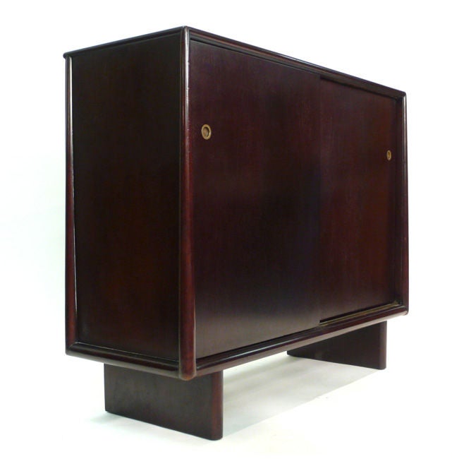 A dark and richly finished mahogany cabinet with 13 contrasting birch interior utility drawers. All sides are finished with a subtly tapering rounded frame. This is the more detailed version of this piece.