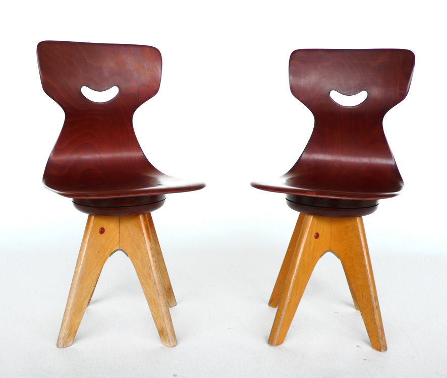 These chairs were designed by Adam Stegner and were produced by Pagholz Flötotto in the 1960s. They were produced for the schulmobel line and have the manufacturers mark impressed into the wood. They are very well made and are crafted from a sturdy