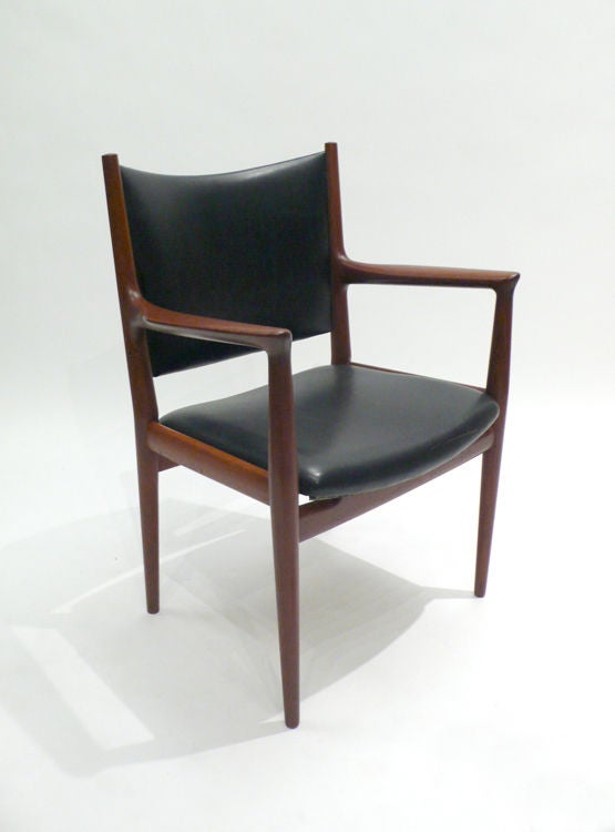 Arm Chair JH-713, solid teak with original black leather upholstery made by Johannes Hansen sold through the Knoll Showroom 1960, retains labels excellent original condition.