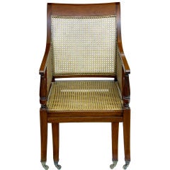 Bergere armchair in mahogany with a pull out foot stool