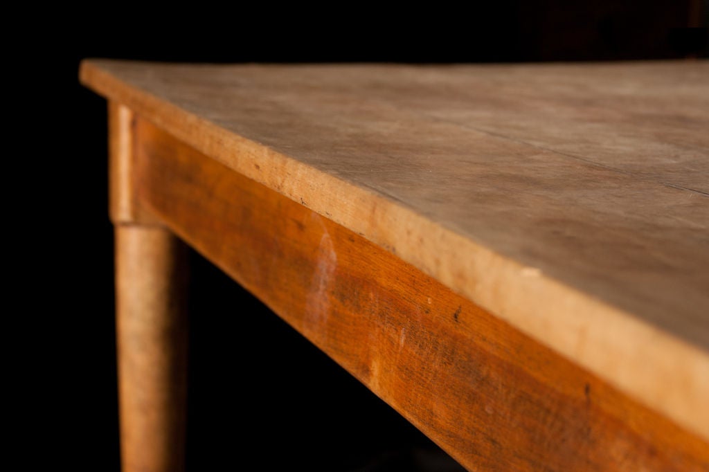 Scrubbed-Top pine dining table with simple legs that end in a simple ball clean design.