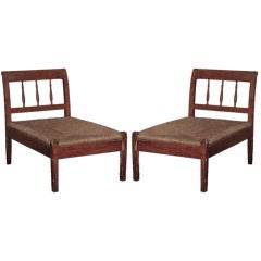Pair of rush seat lounge chairs, primitive form, unique shape