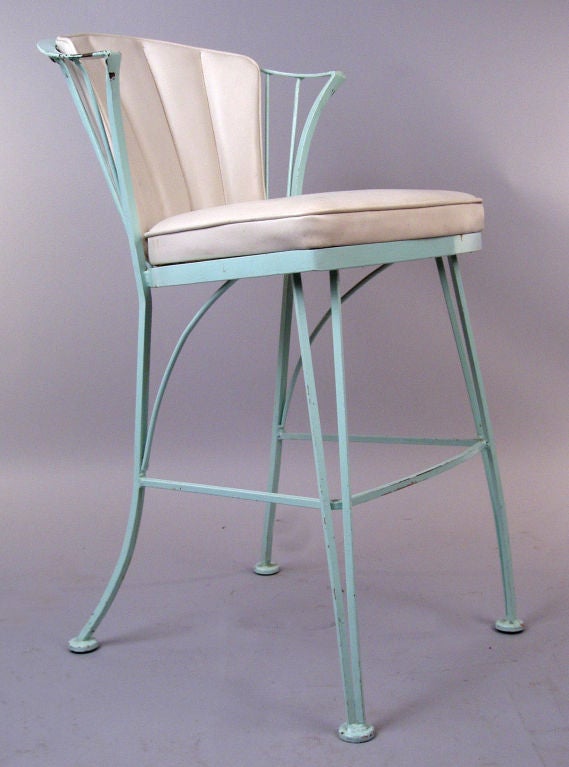 a very nice set of 3 barstools by Russel Woodard. beautiful wrought iron frame, with curved and flared backs and small arms as well. have the original padded seat and channel back cushions. frames excellent, with some finish loss.
