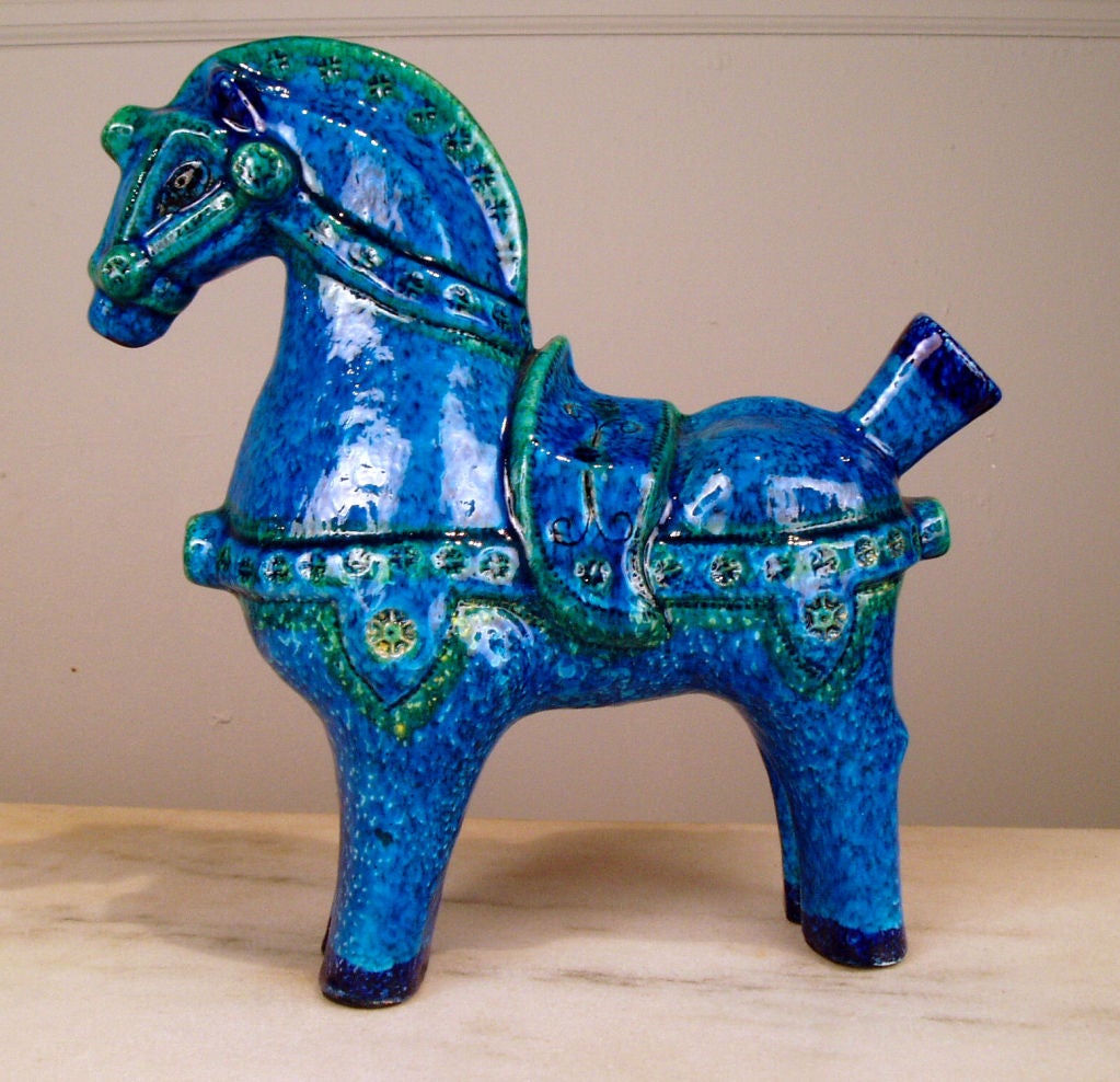a very beautiful ceramic horse attributed to Aldo Londi. fantastic saturated deep blue with green highlights. very charming and in mint condition.   <br />
<br />
<br />
(key: Raymor)