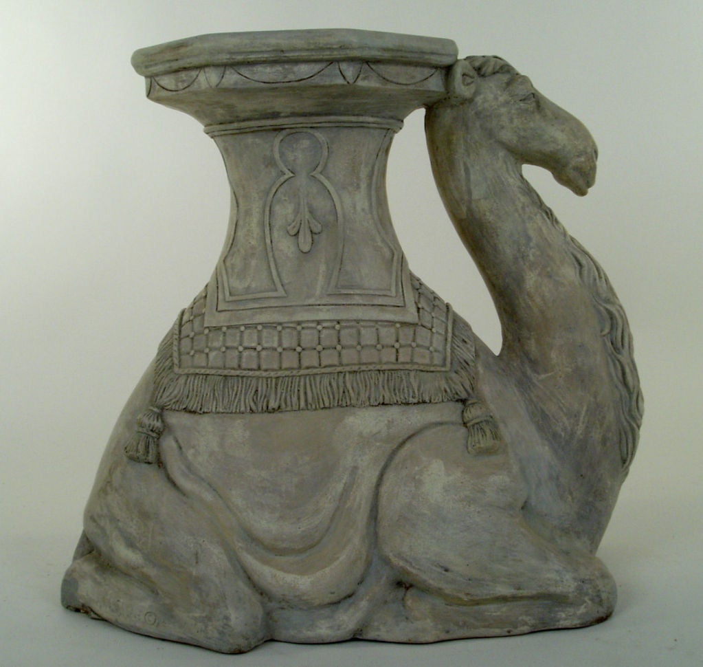 a very sweet and charming plaster stool/table in the form of a seated camel. great details and well made.