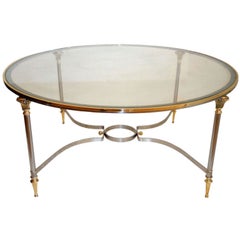 Table basse ronde en acier poli et verre de la Maison Jansen