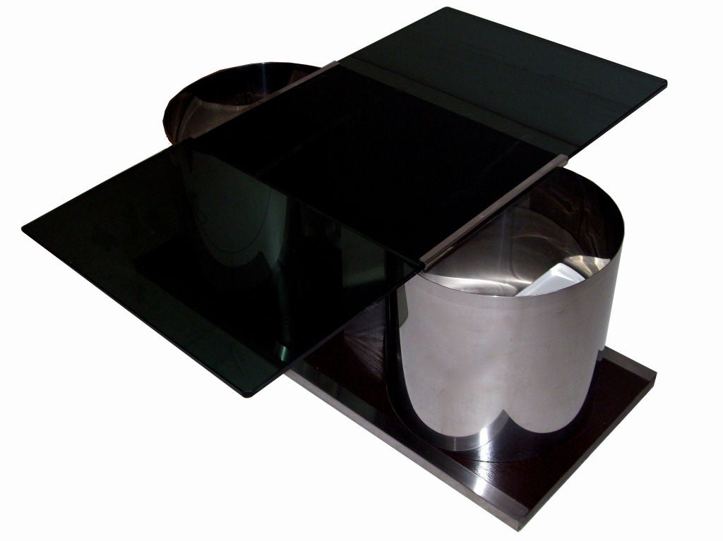 Unique François Monnet French cocktail table with 2 round hidden bars in each coffee table. 
Swivel smoked glass top.
Pair available, priced by item.