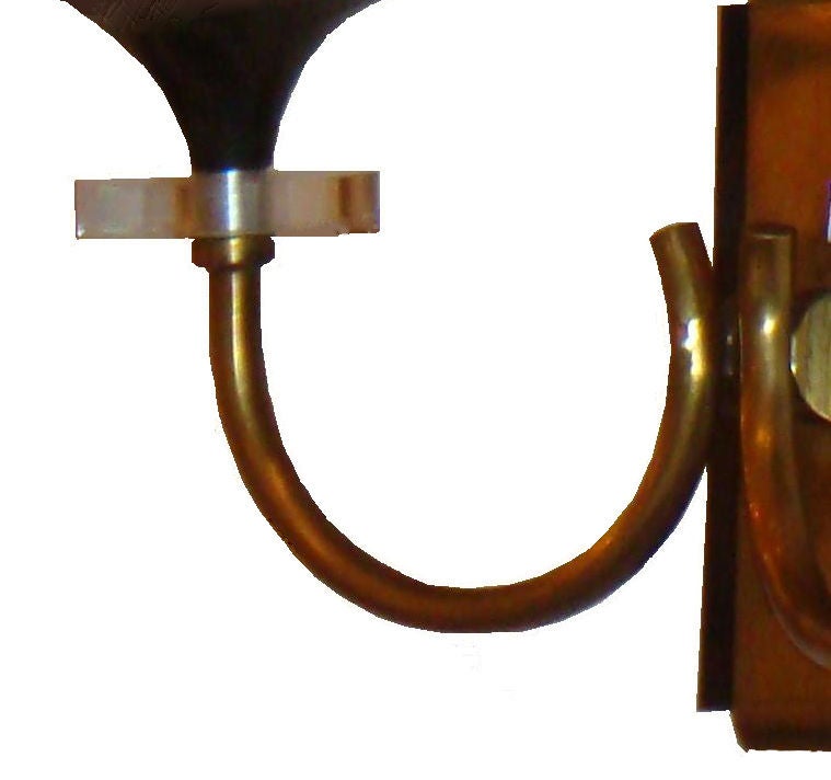 French pairs of sconces Maison Jansen Style , two patinas (gun metal and brass) with clear disc of Lucite under each cup.
Candelabra socket.
Shade : 5 inches H, 4.5 inches H diameter base, 3.5 inches diameter top.
Back plate :  5 H x 2 inches W.
Two