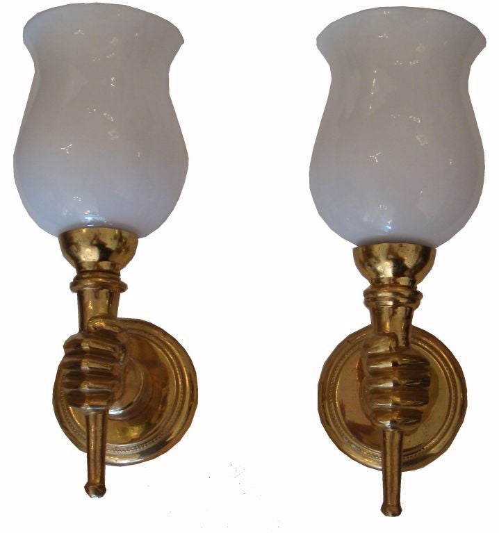 In the manner of Andre Arbus 3 Pairs of very elegant French sconces, wall lights available, featuring a hand holding a torch.
Priced by pair.
Diameter of the back plate: 3.1/4 inches.
Custom Made Junction Box Covers available for an additional