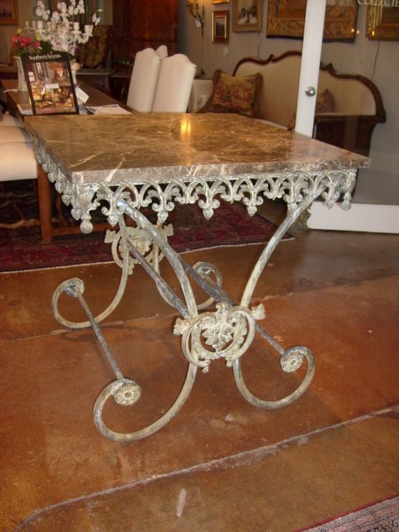 French Iron base with chocolate and taupe marble top.