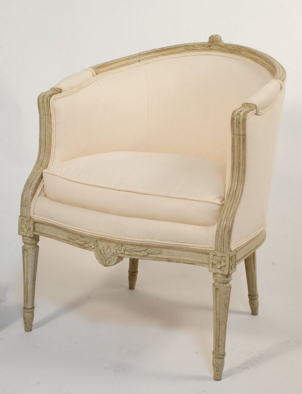 Gustavian Bergeres with floral carvings and round fluted legs.