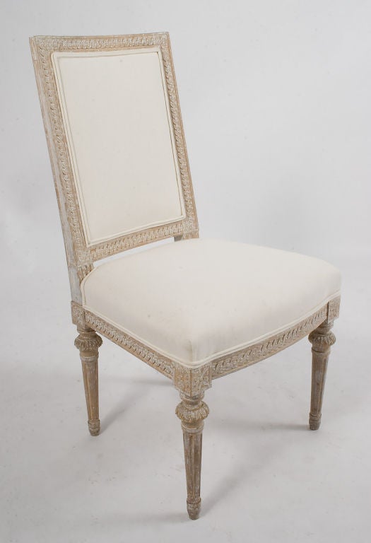 Gustavian Side Chairs signed by Melchior Lundberg (master from 1775-1810). Guilloche carved seat and back rails and framed rosette heading the fluted legs.