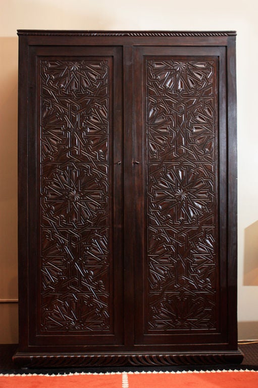 Ahmed Ben Nani<br />
Carved wooden Armoire, two doors with original Art Deco keys Circa 1930.<br />
This armoire comes from a Moroccan Art Deco set including a pair of chairs, an armoire, a stool and a daybed.<br />
The chairs are stamped 