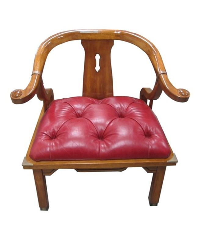 American 1960s. Walnut wood Asian armchair in the style of James Mont with brass detailing and upholstered in red leather with a tufted seat. This wonderful chair is extremely well built and very comfortable. It is generous in size and very sturdy.