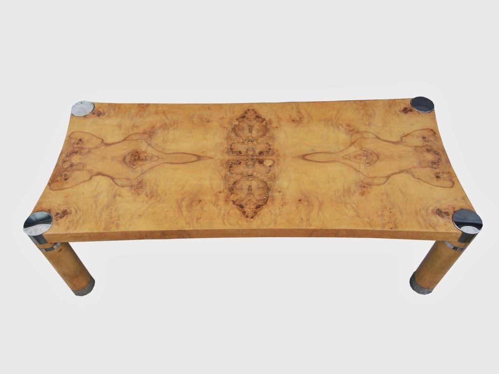 Rare monumental Karl Springer coffee table.
The sexy curves on this piece in unlike anything we have seen and what makes this piece a one of a kind is that Karl Springer rarely worked with burl wood, most of his designs featured a parchment of some