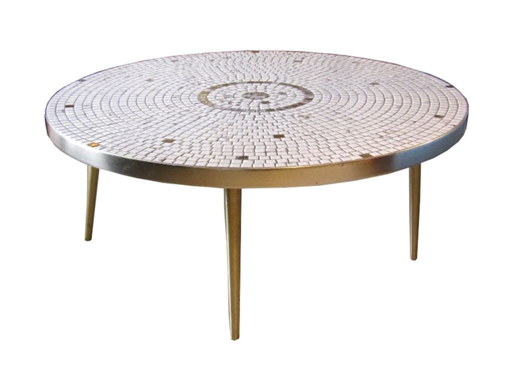 This wonderful vintage table dates from the 1950sand features a bright and colorful tile surface with white and gold tiles with golden circle motif in the middle. This appear to be a custom ordered piece and is labeled as 