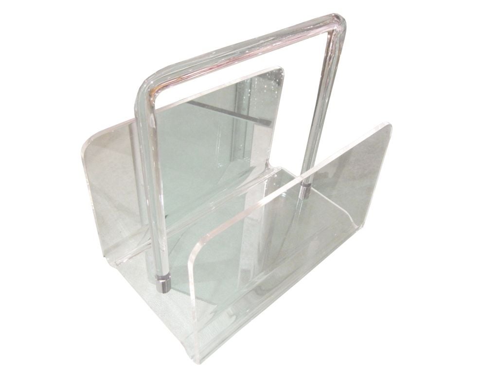 Charles Hollis Jones Lucite magazine holder with a chrome fittings.<br />
<br />
This wonderful piece is another masterpiece by the well known designer Charles Hollis Jones.<br />
<br />
The piece has a  delicate handle with chrome fittings at