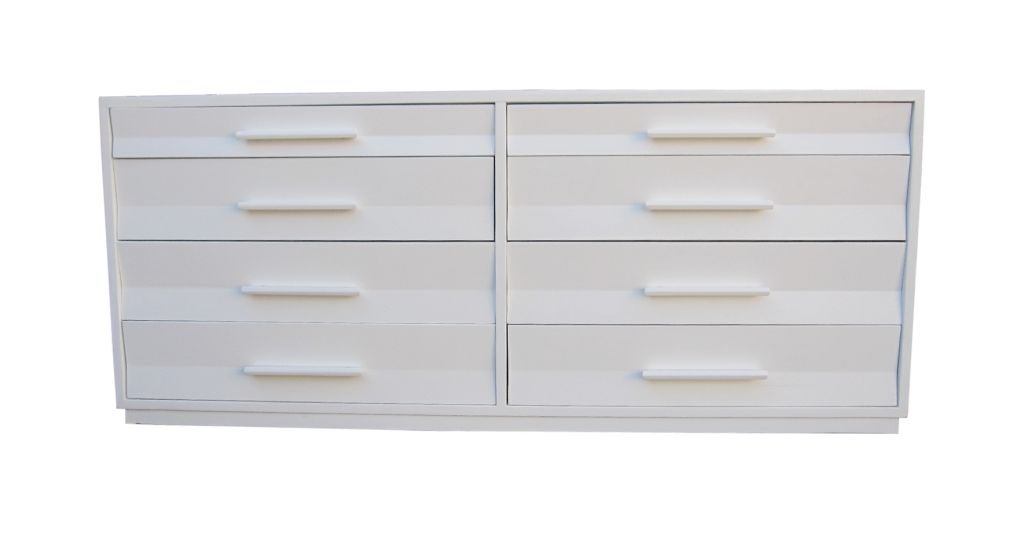 You are viewing a fantastic dresser designed by Edward Wormley for Dunbar, from late 1940s-early 1950s. This exceptionally piece is made of solid wood and finished in a white matte color giving the piece a very sophisticated look.   The design
