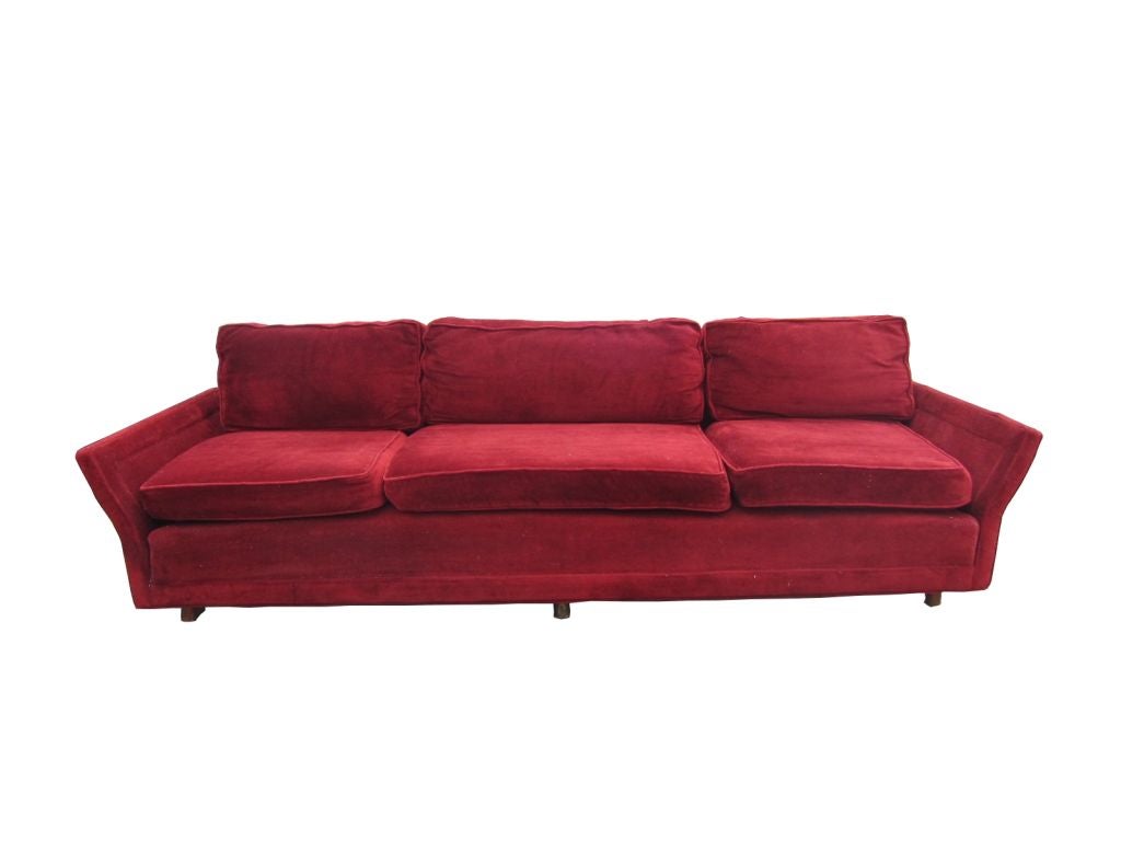 You are viewing a Huge Custom-Made Dunbar Sofa, attributed to Edward Wormley, c1950s.  One of the most beautiful sofas we have seen,   It has a very nice flair on the arms and it seats on a solid walnut cylindrical legs.<br />
The sofa is